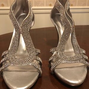 Silver female size 10 shoes w/rhinestones. Excelle